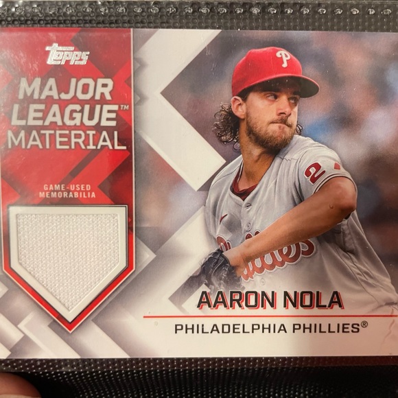 Aaron Nola Topps baseball card with major league material placed inside card. - Picture 1 of 1